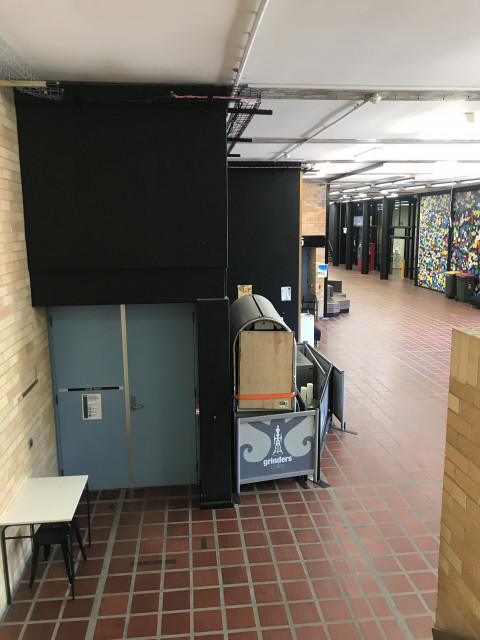 Bottom left door, to the right is HB15 and the main corridor