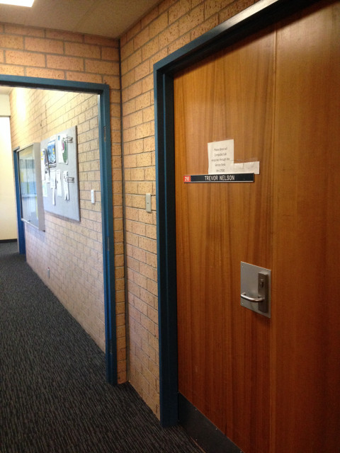 Double wooden doors on your right