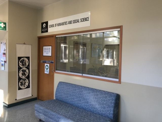 Follow the corridor until you reach the School of Humanities and Social Science administration