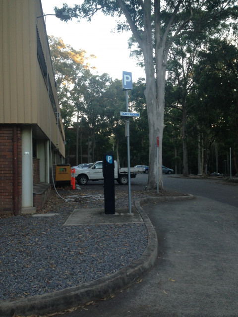 Just behind the EC building, as you come off the road
