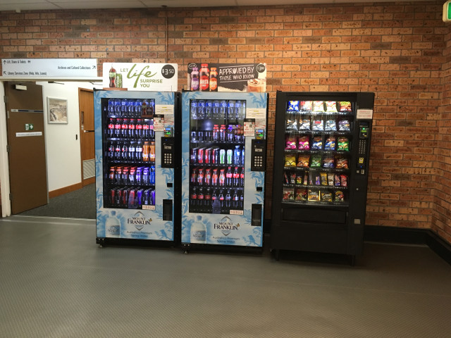 Once you reach these vending machines, turn left again.