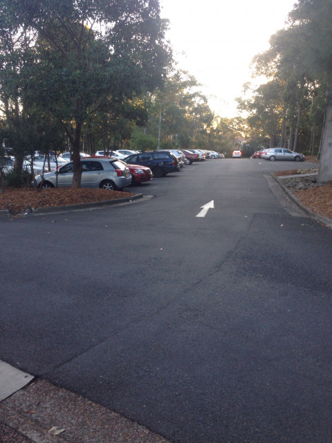 Outdoor parking behind covered building