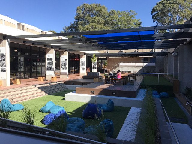 Outdoor student study space near side entrance