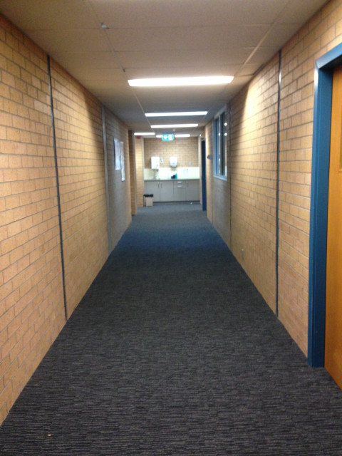 Passageway on right with sink station on far wall