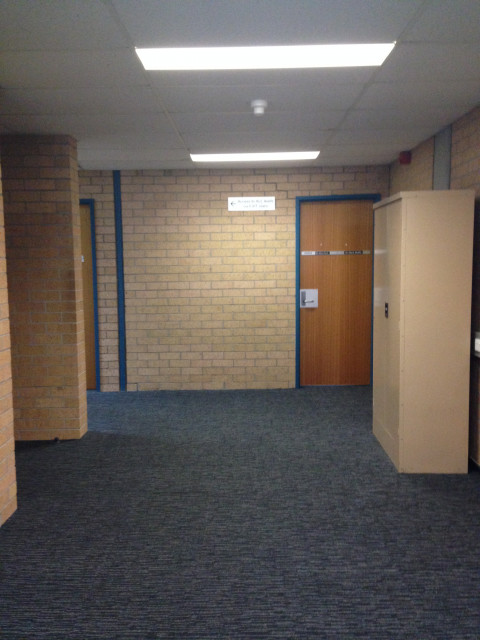 Past the ATM and vending machines