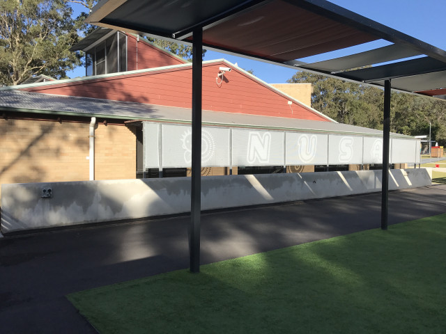 Side of building backing up against Park on the Hill
