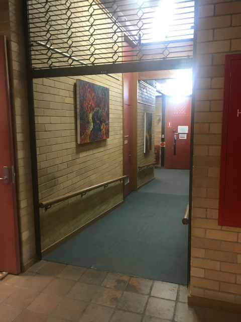 Take this corridor, which is on your right after entering the building