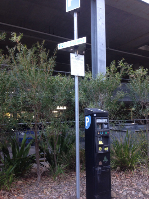 Ticket machine, just out front sheltered parking
