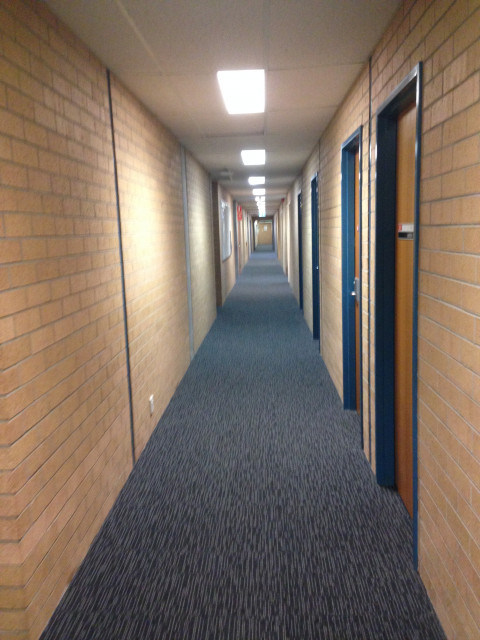 Turn left along and walk along the corridor