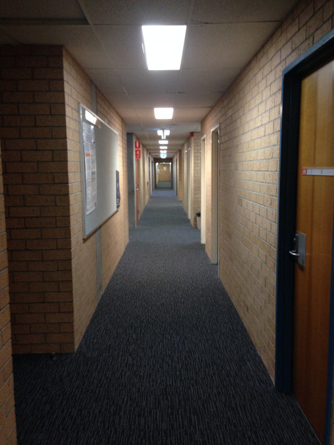 Turn left along and walk along the corridor