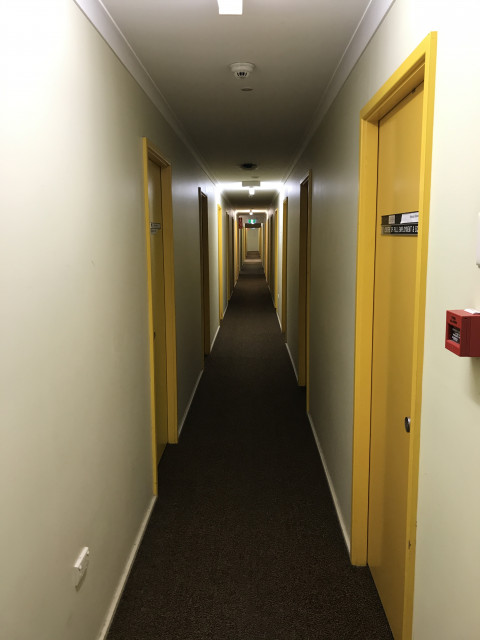 View of corridor from second level south entrance. OB61 is the second room on the left.